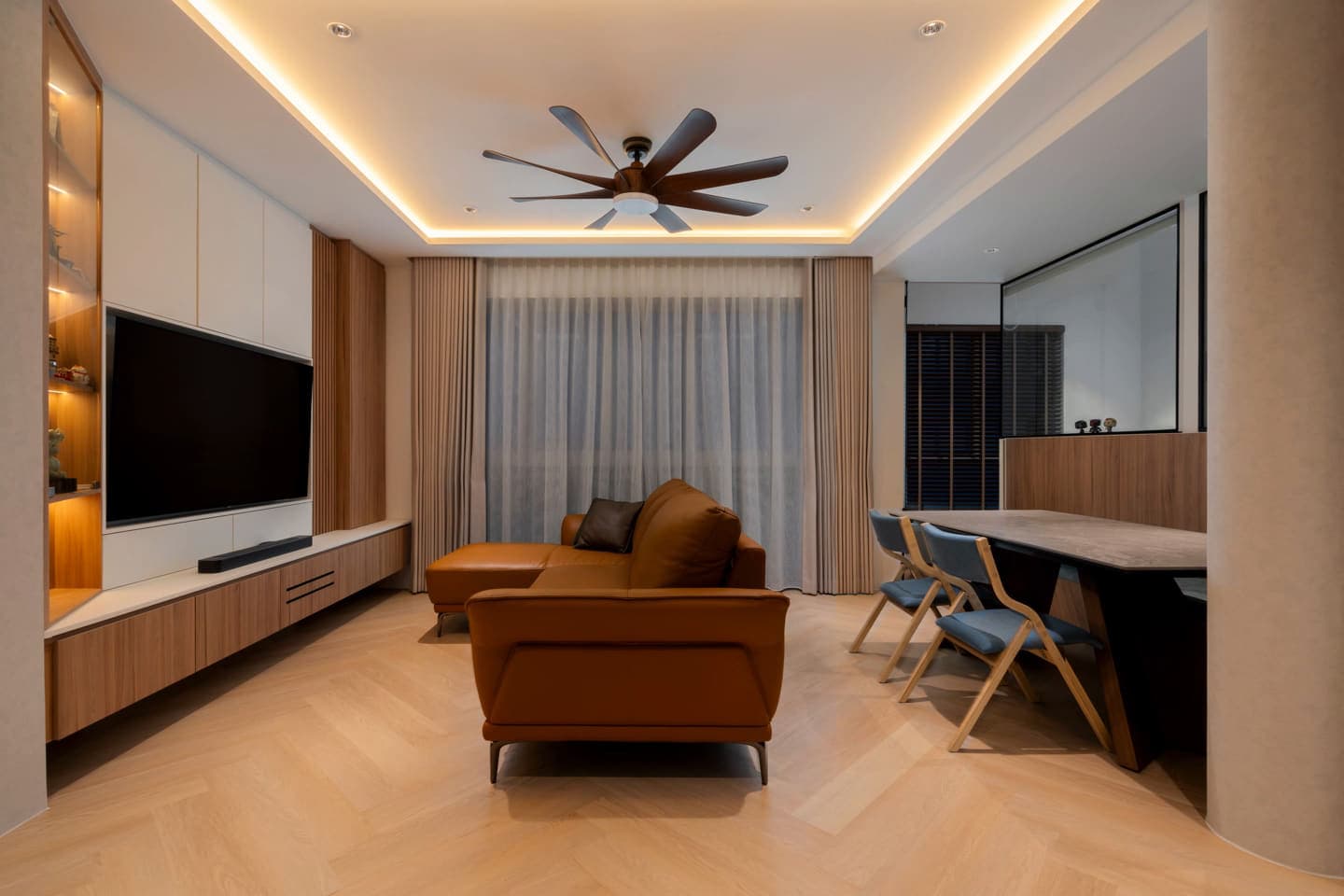 The living room's cove lighting sweeping from cool white through to warm, the timber and floor warming with it.